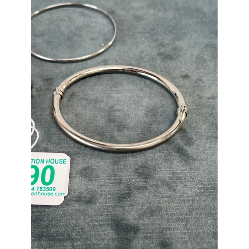 590 - 2 x sprung hinge silver bangles 
1 x stiff silver bangle