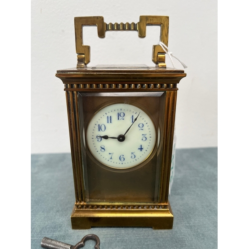 173 - Brass and enamel faced carriage clock. With key 

Not working