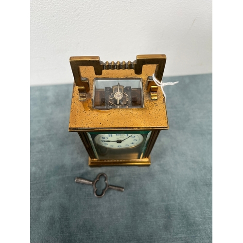 173 - Brass and enamel faced carriage clock. With key 

Not working