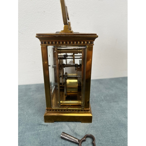 173 - Brass and enamel faced carriage clock. With key 

Not working