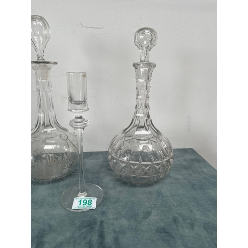 198 - 3 x Cut crystal decanters.
2 x Glass candlesticks