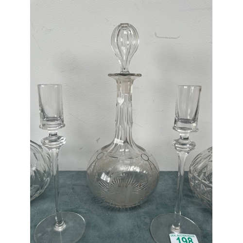 198 - 3 x Cut crystal decanters.
2 x Glass candlesticks