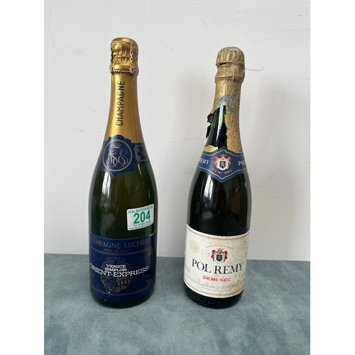 204 - One bottle of Orient Express Champagne. Along with one other bottle of Pol Remy Demi-Sec