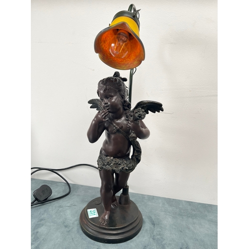 231 - Resin table lamp of a cherub girl with colored glass shade