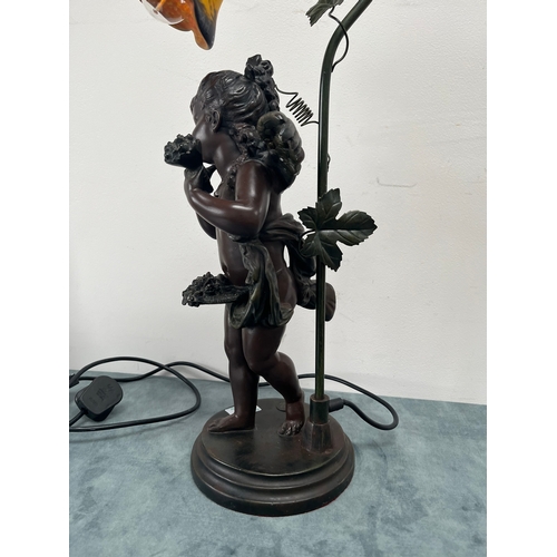 231 - Resin table lamp of a cherub girl with colored glass shade