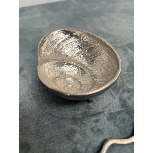 252 - Small ammonite/ shell shaped silver plate bowl with matching spoon