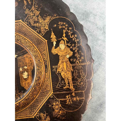 266 - Black lacquer oriental Chinese plate paper mache. Decorated with gold gilt and chinoiserie