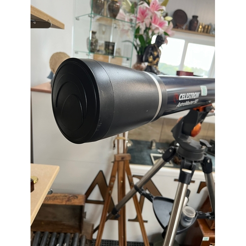 351 - Celestron AstroMaster 90 telescope on stand