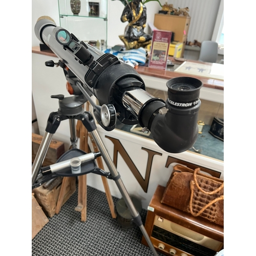 351 - Celestron AstroMaster 90 telescope on stand