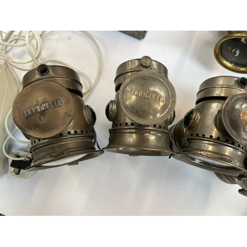 357 - Group of four G.H. Vitaphare carbide lamps