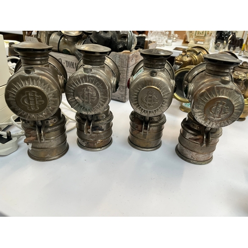 357 - Group of four G.H. Vitaphare carbide lamps