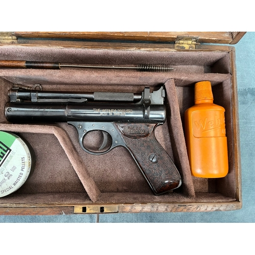 399 - Cased Webley Premier .22 pistol. 1950's, with age related accessories