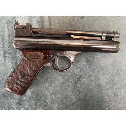 399 - Cased Webley Premier .22 pistol. 1950's, with age related accessories