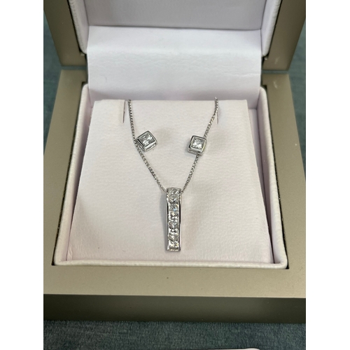 622 - White gold 9ct gold CZ necklace and earrings