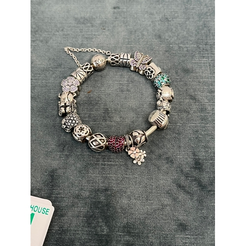 641 - Pandora silver bracelet with lots of charms