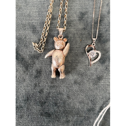 654 - Silver articulated teddy bear necklace + one other silver necklace