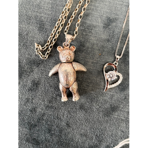 654 - Silver articulated teddy bear necklace + one other silver necklace