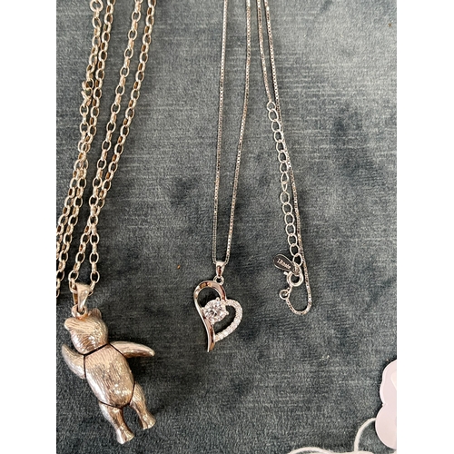 654 - Silver articulated teddy bear necklace + one other silver necklace