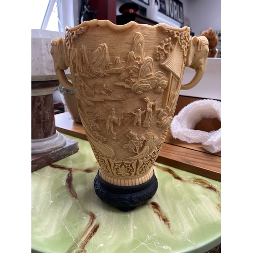 419 - Large resin vase featuring elephants and oriental scenes