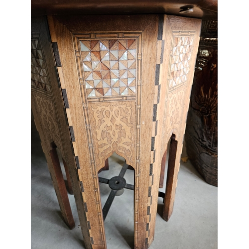 10 - Hexagonal highly decorated table. Mother of pearl and burr woods.