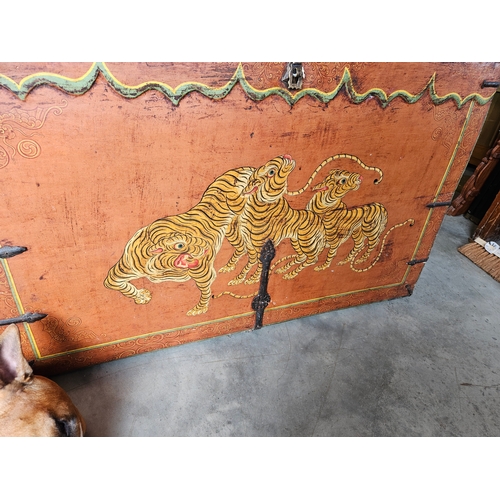 60 - A Tibetan polychrome tiger chest, 18th century, with iron fittings, the front painted with a tiger