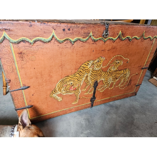 60 - A Tibetan polychrome tiger chest, 18th century, with iron fittings, the front painted with a tiger