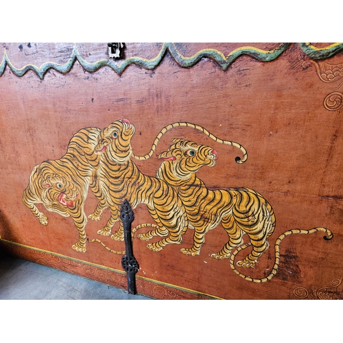 60 - A Tibetan polychrome tiger chest, 18th century, with iron fittings, the front painted with a tiger