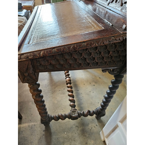 79 - Antique highly carved desk with leather top.