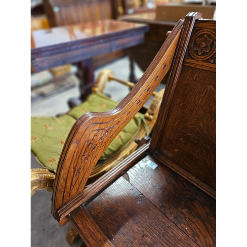 83 - Oak carved Glastonbury style chair