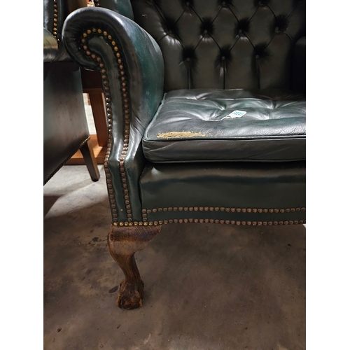 53 - Leather chesterfield wingback armchair. 
Needs a good clean