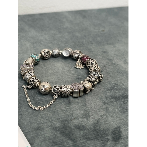 641 - Pandora silver bracelet with lots of charms