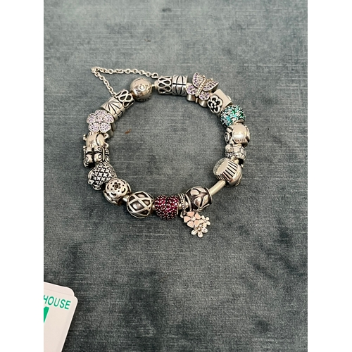 641 - Pandora silver bracelet with lots of charms