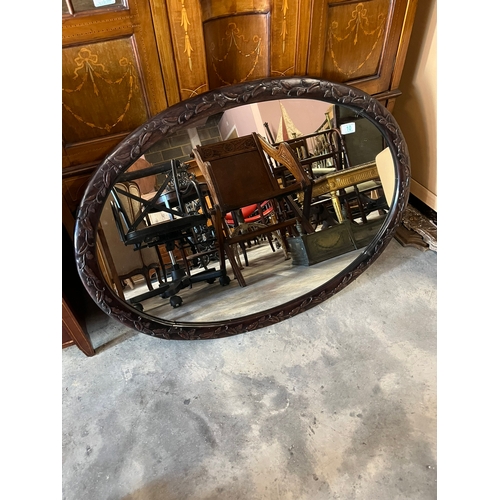 10 - Large oval wall mirror with carved detail