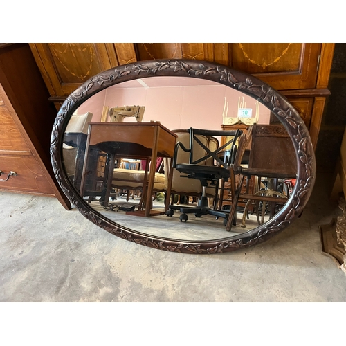 10 - Large oval wall mirror with carved detail