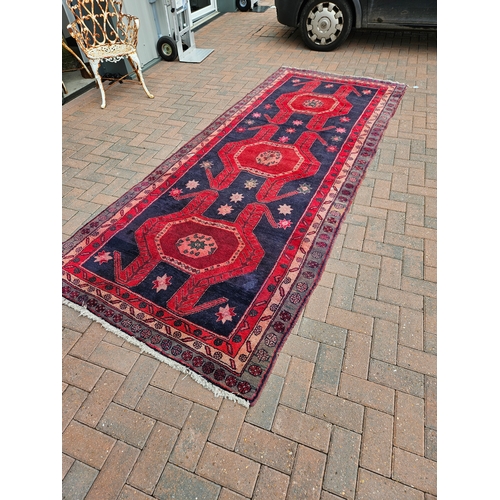 119 - Large antique Aztec design rug

135cm x 336cm