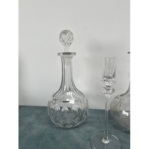 198 - 3 x Cut crystal decanters.
2 x Glass candlesticks