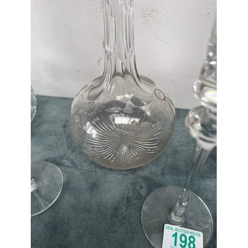 198 - 3 x Cut crystal decanters.
2 x Glass candlesticks