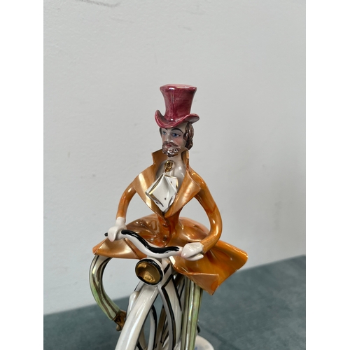 315 - Italian porcelain man riding a penny farthing