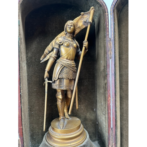 327 - Antique bronze figure of Joan of Ark in leather traveling case 

Signed to base - Ernest Justin Ferr... 