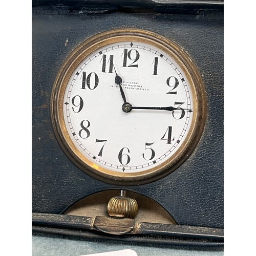 372 - Antique traveling leather cased clock