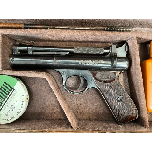 399 - Cased Webley Premier .22 pistol. 1950's, with age related accessories