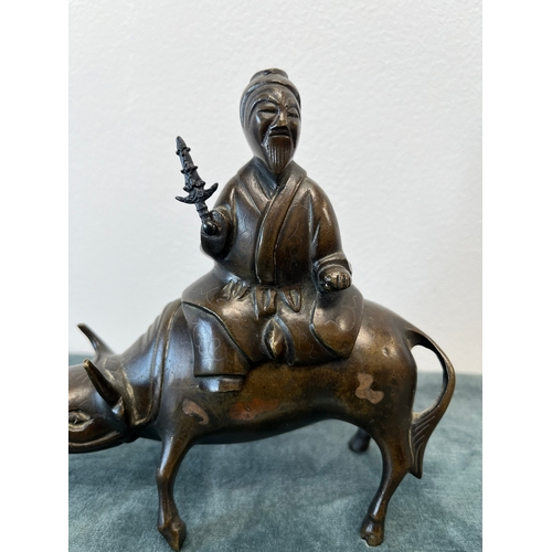 182 - Chinese bronze incense burner, fashioned as a Tao Philosopher Lazo riding a water buffalo