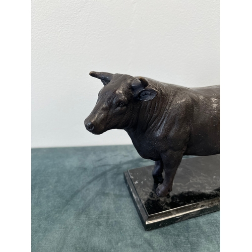 185 - Modern bronze model of a bull on a marble base