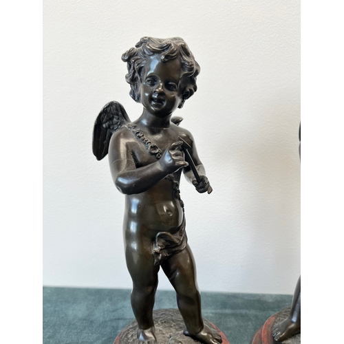 193 - Bronze model of Cupid on a marble base