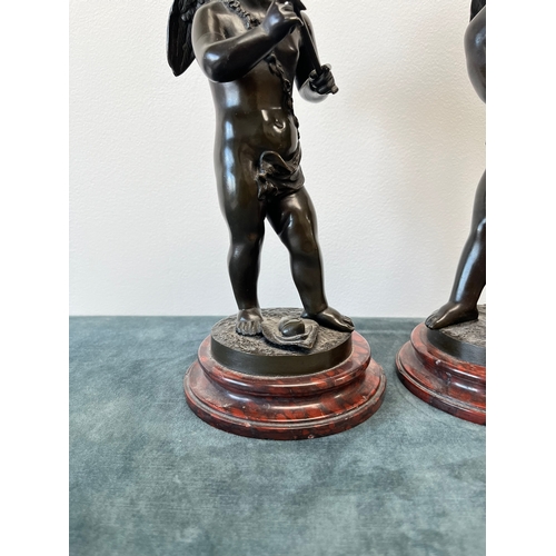 193 - Bronze model of Cupid on a marble base