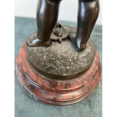 193 - Bronze model of Cupid on a marble base