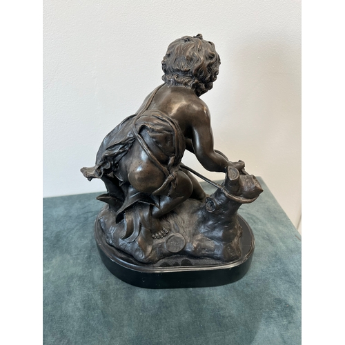 199 - Large modern bronze model of a cherub boy with a chicken.