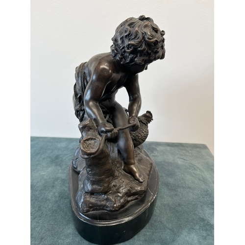 199 - Large modern bronze model of a cherub boy with a chicken.