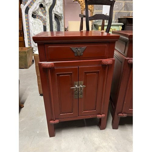 1 - Pair of red oriental side cabinets with brass handles