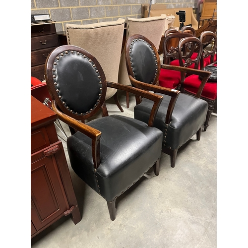 2 - Pair of black leather armchairs with brass stud details